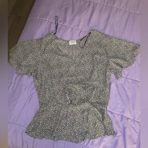 Gray and a little bit of black dots shirt